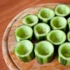 Portioned salad in cucumber cups